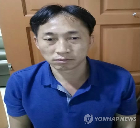 资料图片：接受马来西亚警方调查的李正哲（韩联社/欧新社）