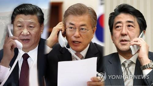 资料图片：左起依次为习近平、文在寅和安倍晋三 韩联社