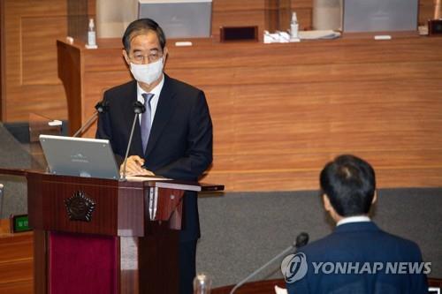 韩国国务总理韩悳洙答议员问。 韩联社