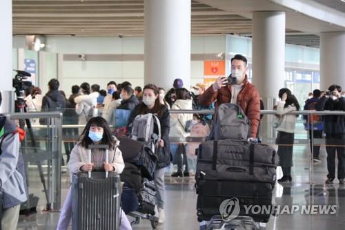 资料图片：1月8日的北京首都机场 韩联社