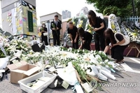 School denies speculation about a young teacher's apparent suicide