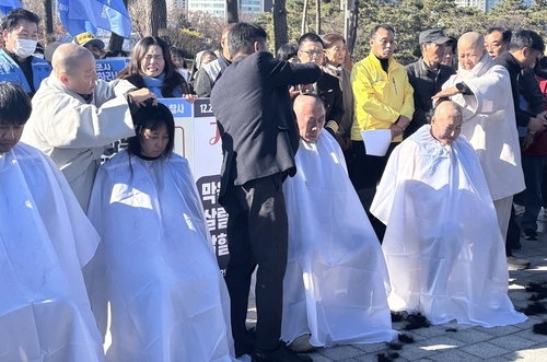 Family members of Jeju Air crash victims shave heads in protest over credibility of interim probe results