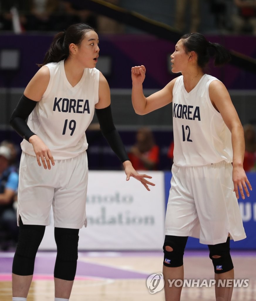 资料图片：2018年9月，在印尼雅加达，韩朝组联队参加女子篮球比赛。（韩联社）