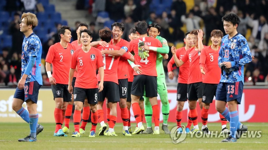 资料图片：韩国队庆祝战胜日本队。 韩联社