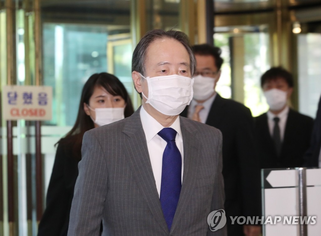 6月15日下午，在首尔市钟路区，冨田浩司应约到达韩国外交部。 韩联社