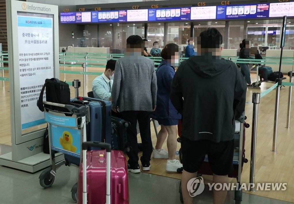 韩侨乘临时航班返华 韩侨乘临时航班返华