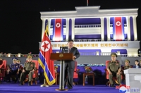 朝鲜新型导弹发射车交接仪式